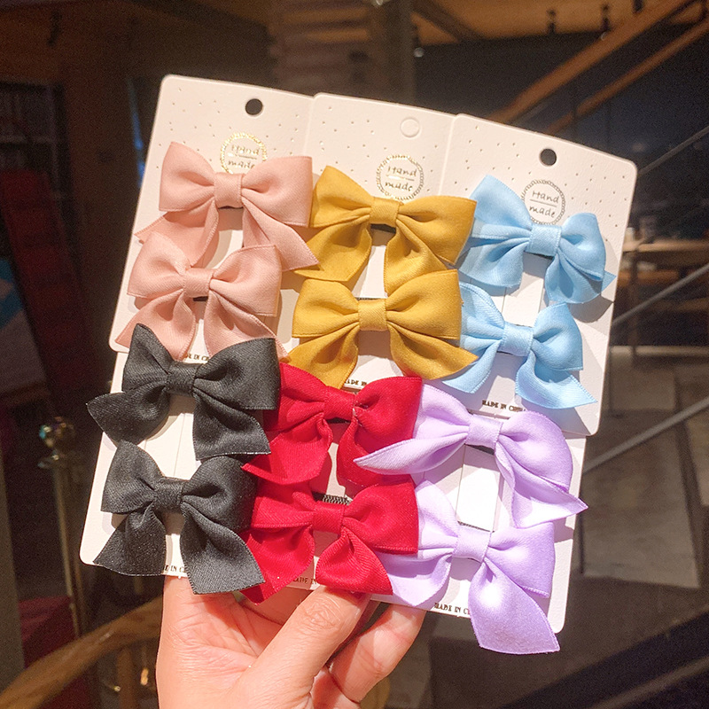 Korean Style Solid Color Children's Bow Hairpin display picture 1