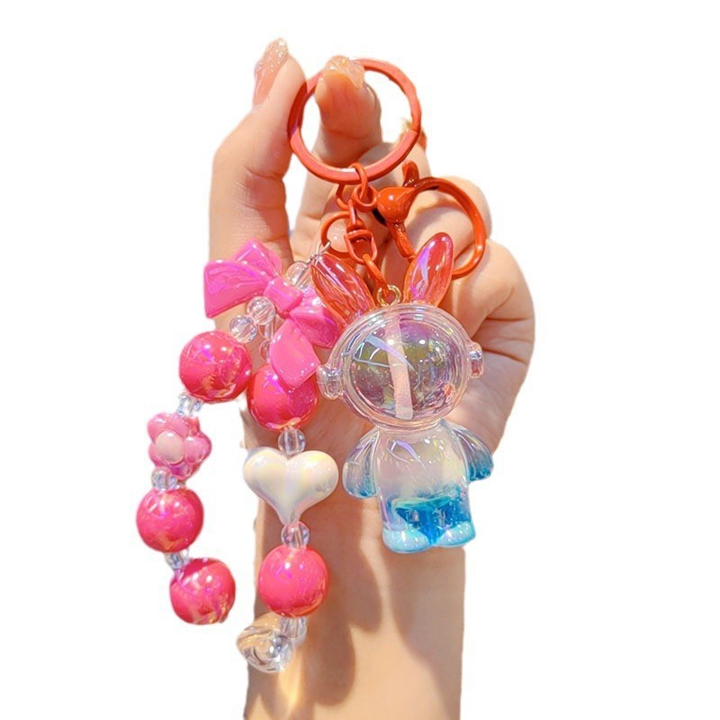 Nuevo colorido cuentas para usar auriculares bolsos de resina de conejo aeroespacial colgante de dibujos animados conejo llavero accesorios para estudiantes