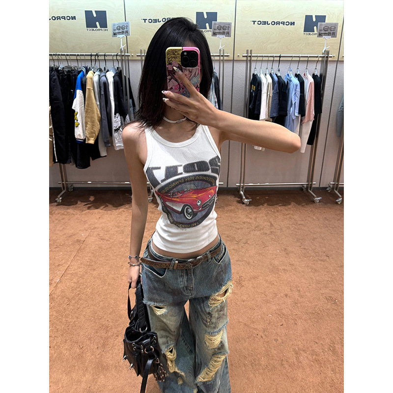 ファッションのファッションブランドの廃土の風は墨をかけて穴のジーパンの女性の秋の新型をつぶします。|undefined