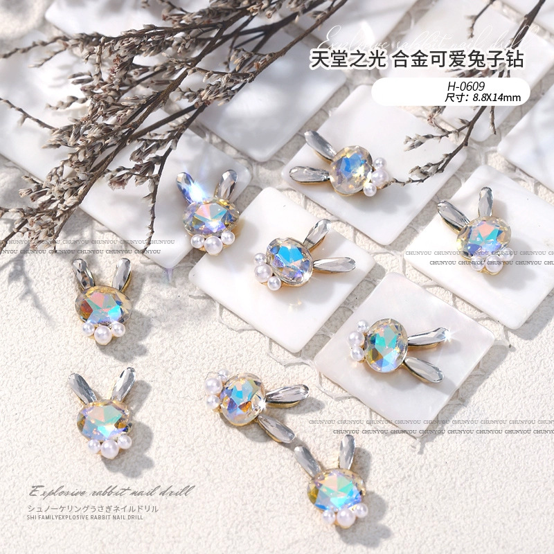 Nuevo acabado lindo flash conejo aleación diamante conejito cabeza perla pila diamante combinación manicura uñas joyería diamante