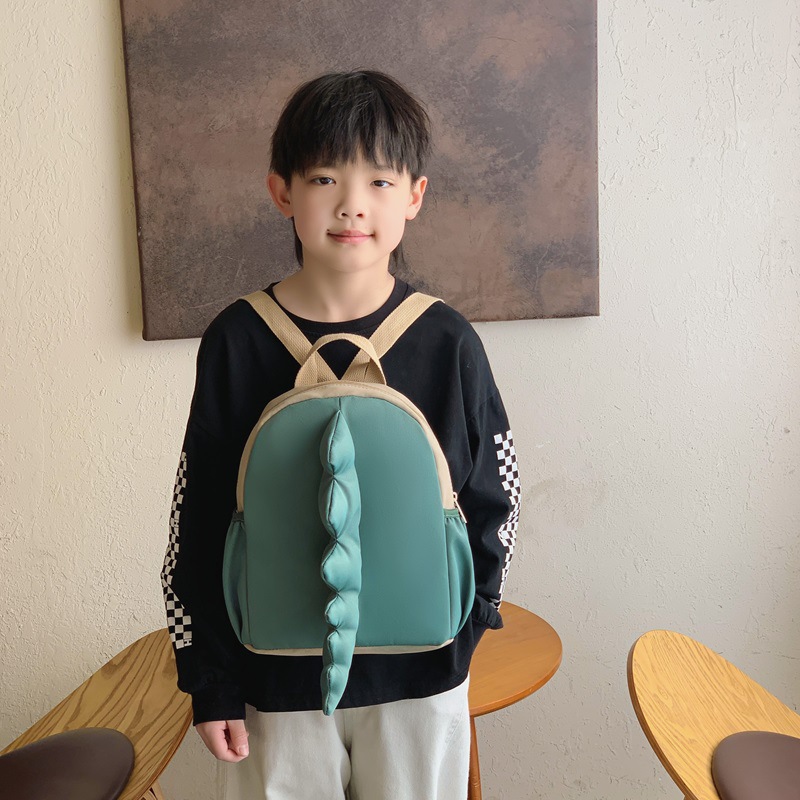 Mochila infantil transfronteriza de dibujos animados lindos dinosaurios cola mochila para niños y niñas jardín de infantes pequeña clase mochila para niños