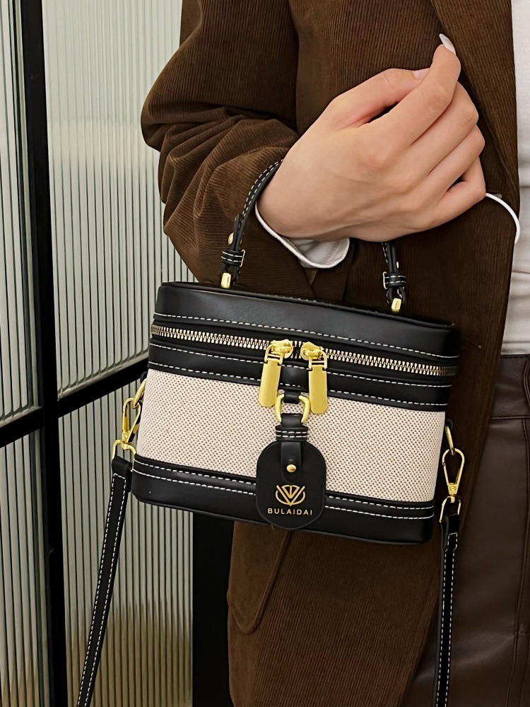 Bolso de mano de alta sensación para mujeres 2025, nueva moda transfronteriza, bolso de caja de empalme de color, bolso casual, bolso cuadrado simple