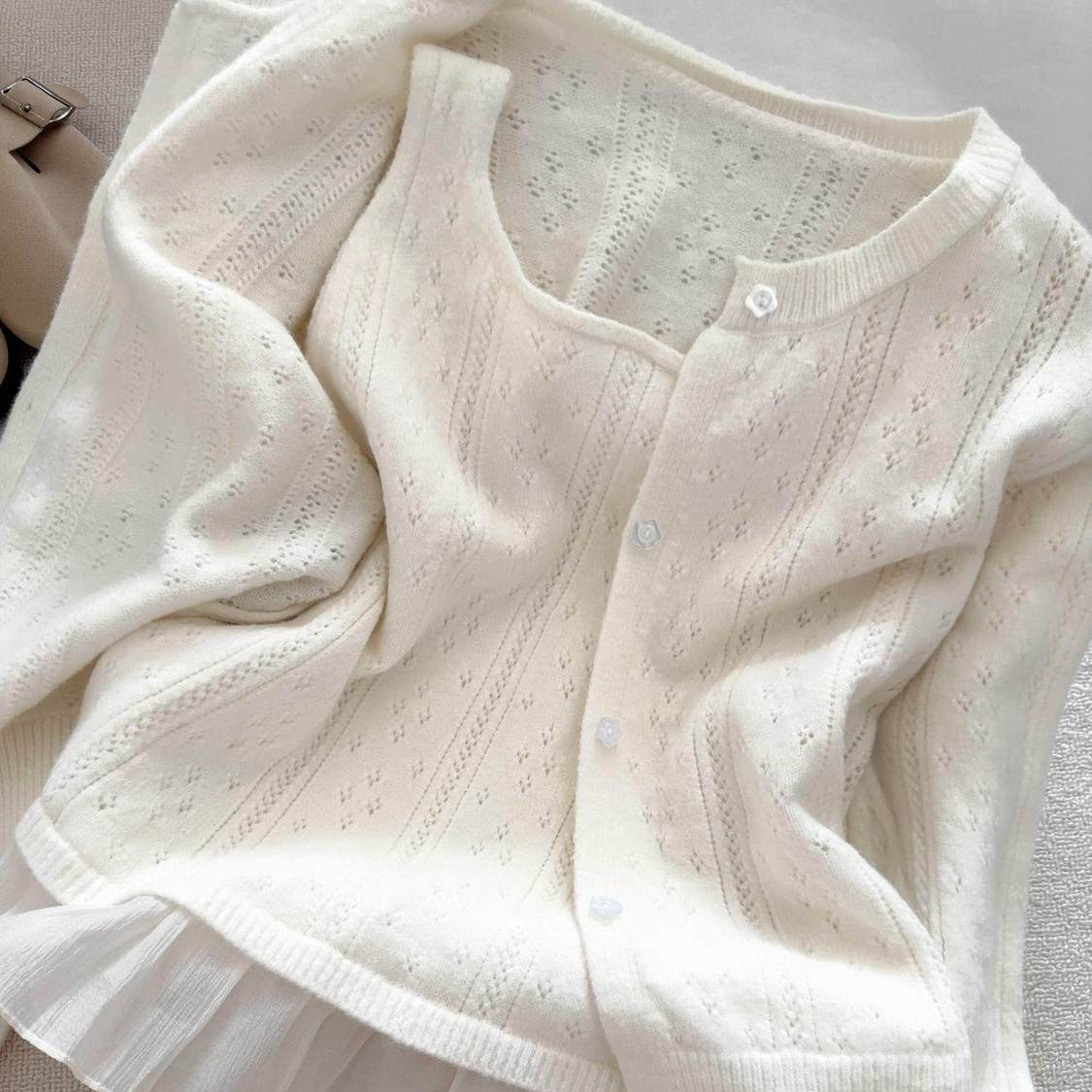 Gentle style white hollow-out knitted cardigan for women with a camisole two-piece set, versatile for commuting, textured early spring sweater coat
