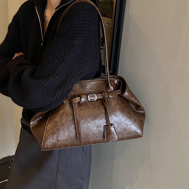 Alta textura retro gran capacidad hombro brazo bolso de mujer 2025 nuevo otoño invierno universal bolso de mano de viaje