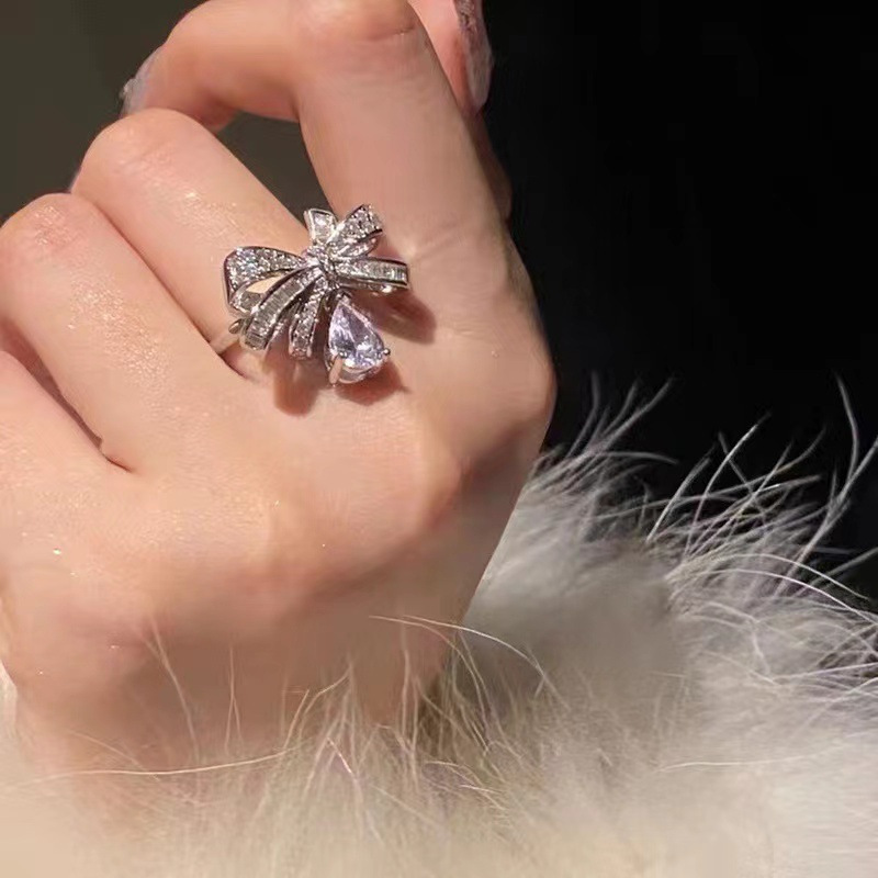 Adjustable three dimensional small design ring with bow drop-shaped