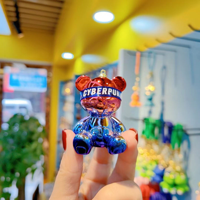 Resina de dibujos animados colorido gradiente oso llavero creativo postura sentada red oso llavero de moda colgante de llave de automóvil