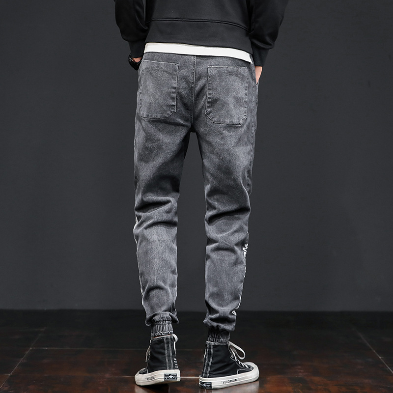 Jeans casuales de cintura elástica sueltos para hombres primavera de moda coreana para hombres, nueve puntos.