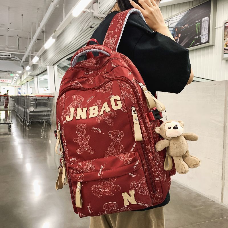 减负书包男生高中生大容量双肩包初中女生印花大学生休闲旅行背包|undefined