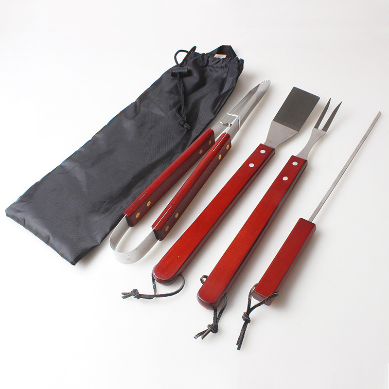 BARBACOA de acero inoxidable mango de madera de cuatro piezas herramienta de barbacoa tenedor pala bolsa de tela traje de barbacoa fuente de fábrica