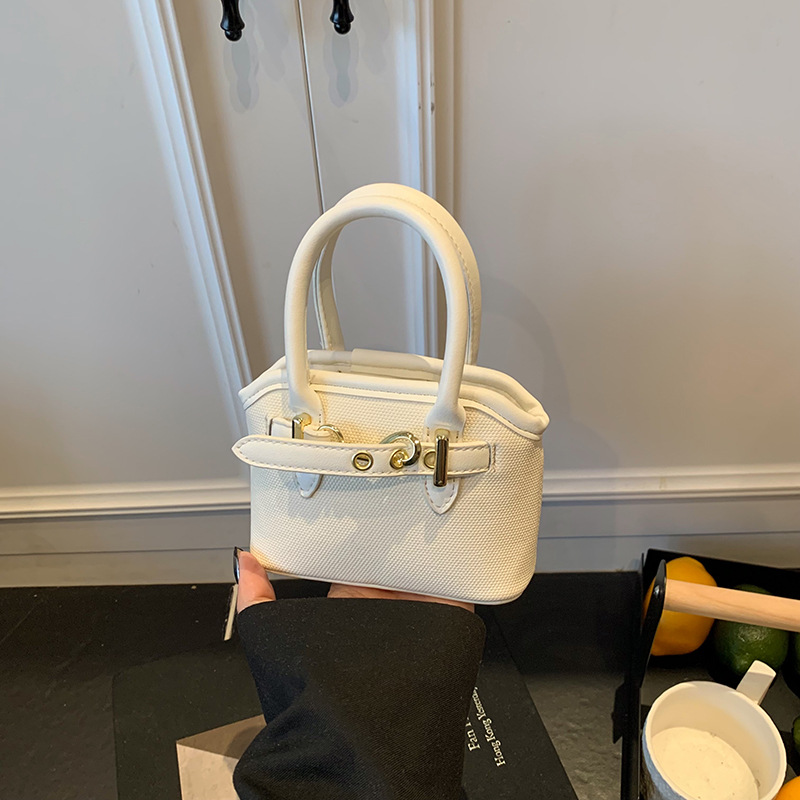 Bolsos de mano para niños lindos colgantes extranjeros mini bolsos de hombro para niños y niñas de color sólido simple bolsos de conchas de niños de moda