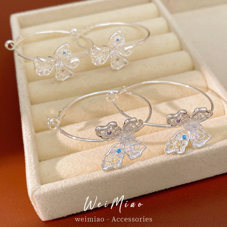 Aguja de plata Zircon hueco flores mariposa pendientes ligeros de lujo de alta calidad personalidad nicho temperamento moda pendientes mujeres