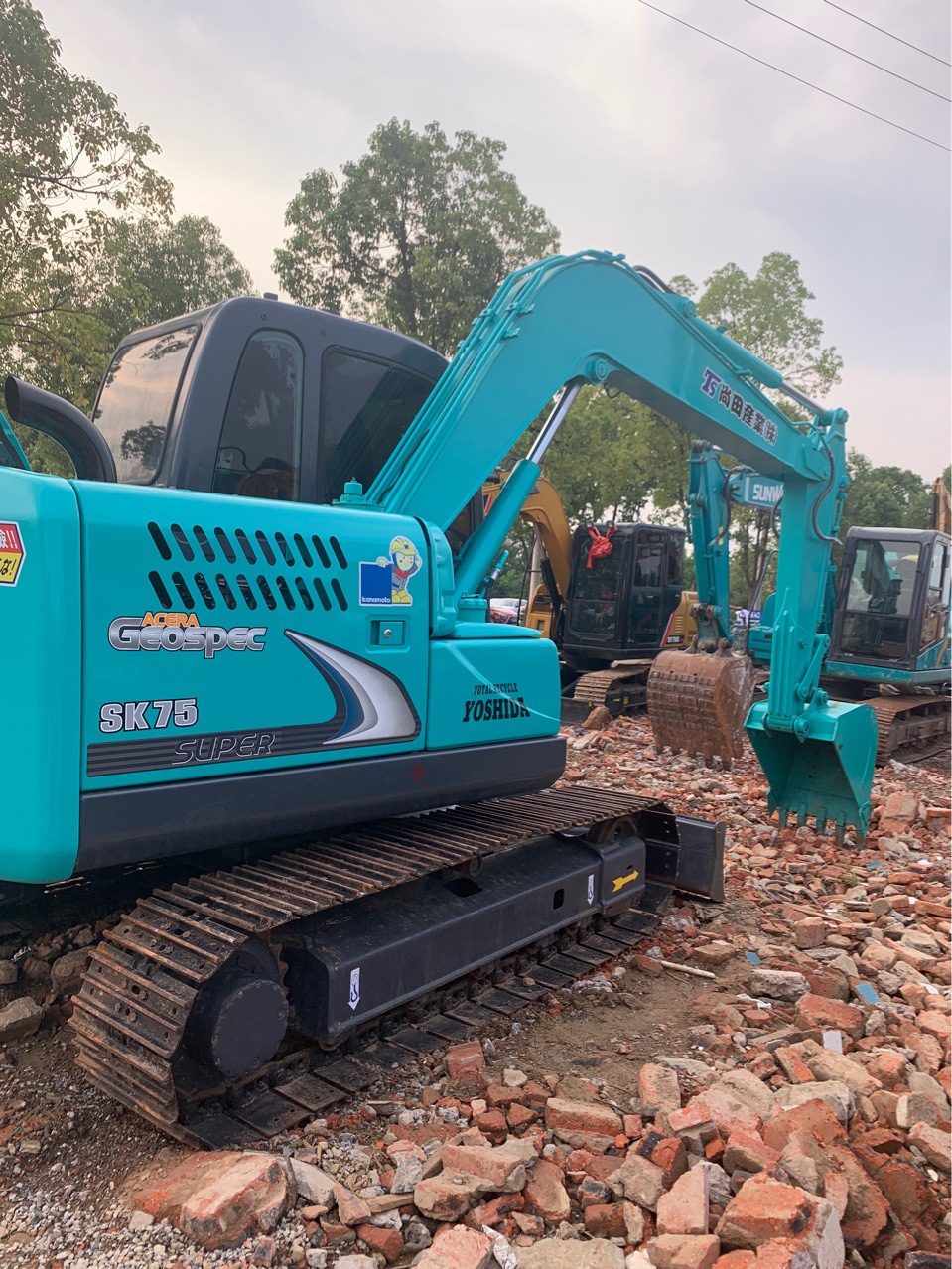 Exportación de comercio exterior de segunda mano Shengang 75 y 80 excavadoras con martillo de trituración original