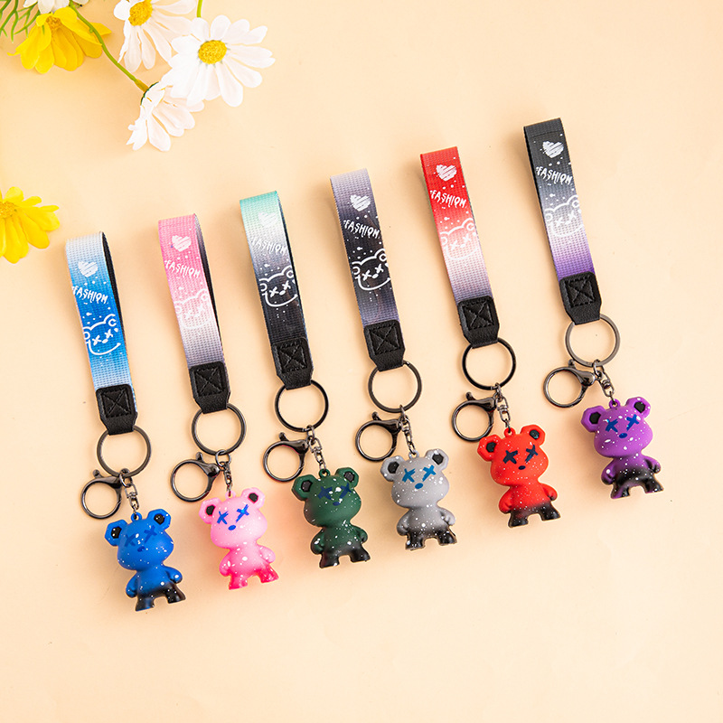 Creativo, colorido, violento, muñeca de oso de dragón, método de lucha de perros, llavero de muñeca de moda, llavero de personalidad de coche