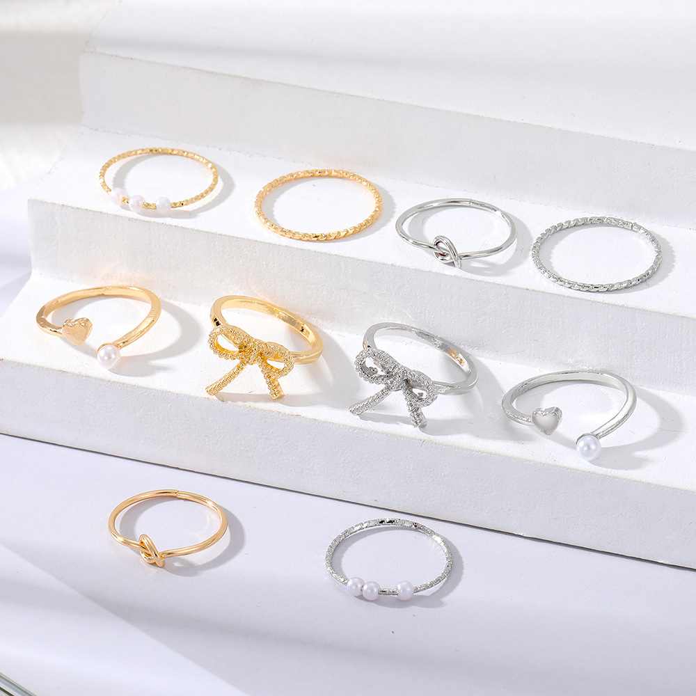 Golden elegant ring with bow pearl
