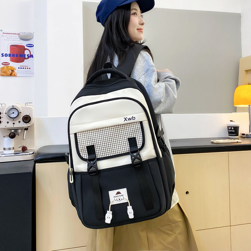 Al por mayor 2025 nuevos estudiantes de primaria de secundaria masculinos mochila de escolares de escolares de alta niñas mochila de viaje de gran capacidad