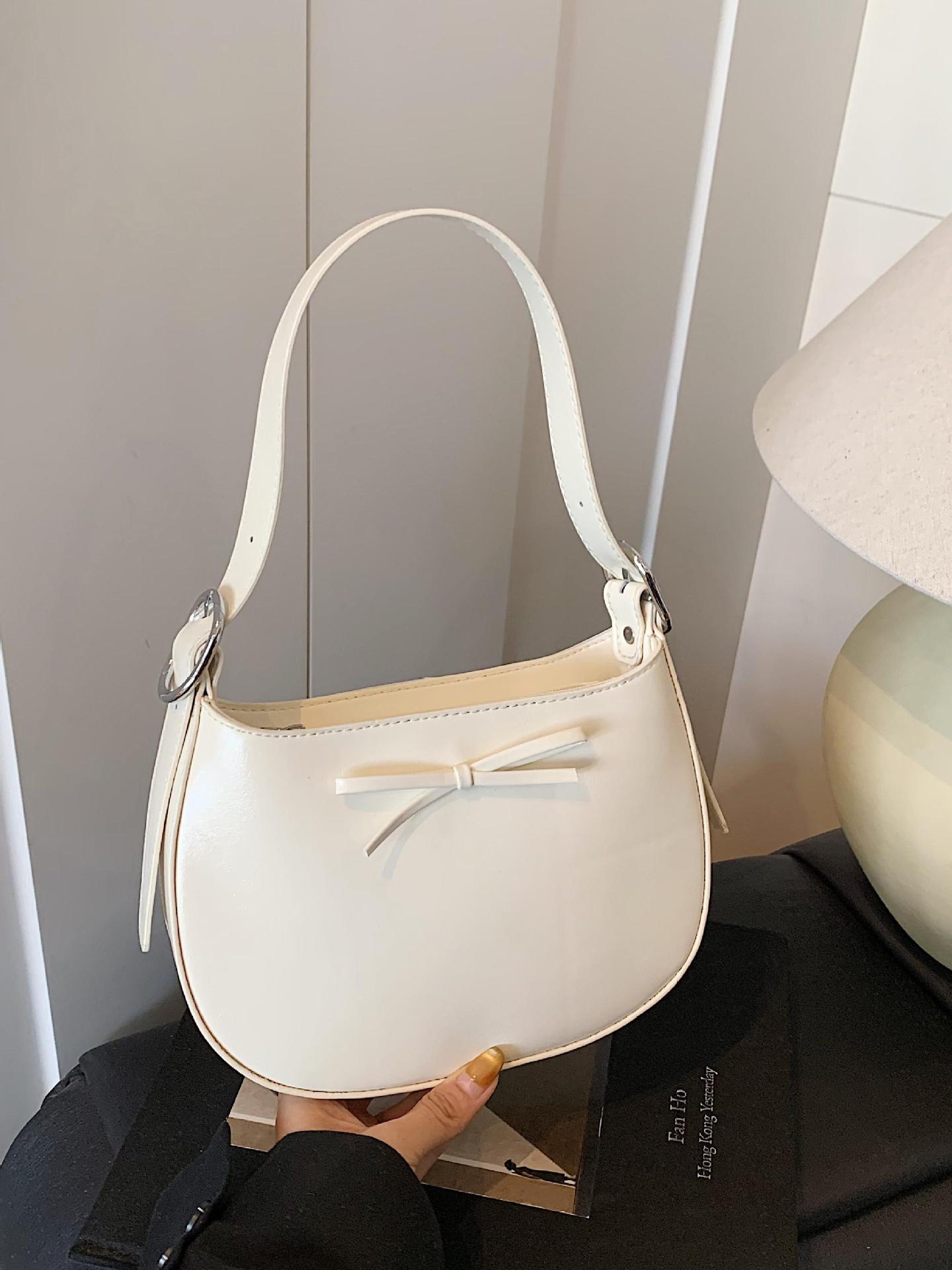 Nicho coreano de lujo ligero arco brazo bolso para mujeres 2025 nuevo estilo versátil bolso de hombro de estilo extranjero bolso de moda