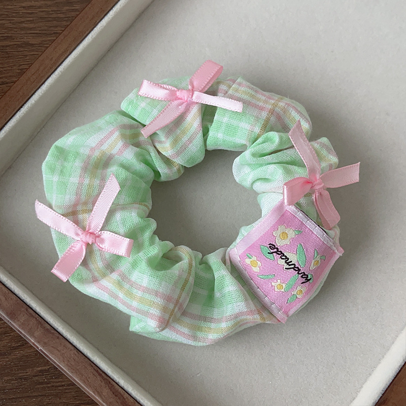 With bow, green