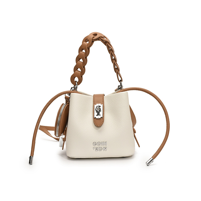 Bolso de mujer 2025 nuevo bolso de mensajero de hombro con patrón de lichi de alta calidad bolso de cubo portátil de moda casual de todo fósforo