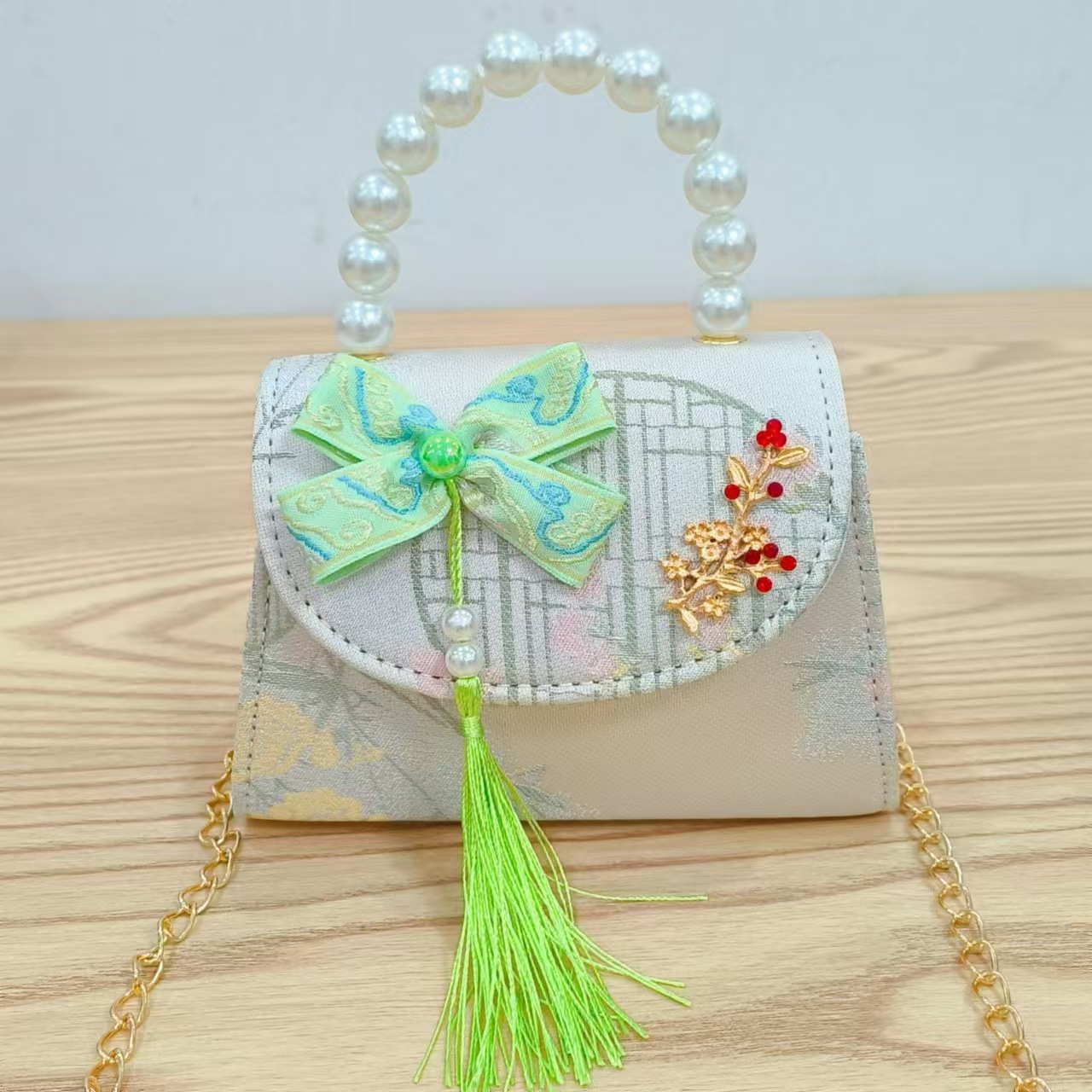 Bolsas de niños arco de estilo chino borda de niña pequeña princesa perla bolsa de cambio de mano al por mayor