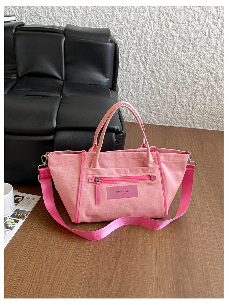 Bolso de lona de gran capacidad para mujeres 2026 nuevo tipo de mochila de hombro simple y casual para la clase de la bolsa de viaje