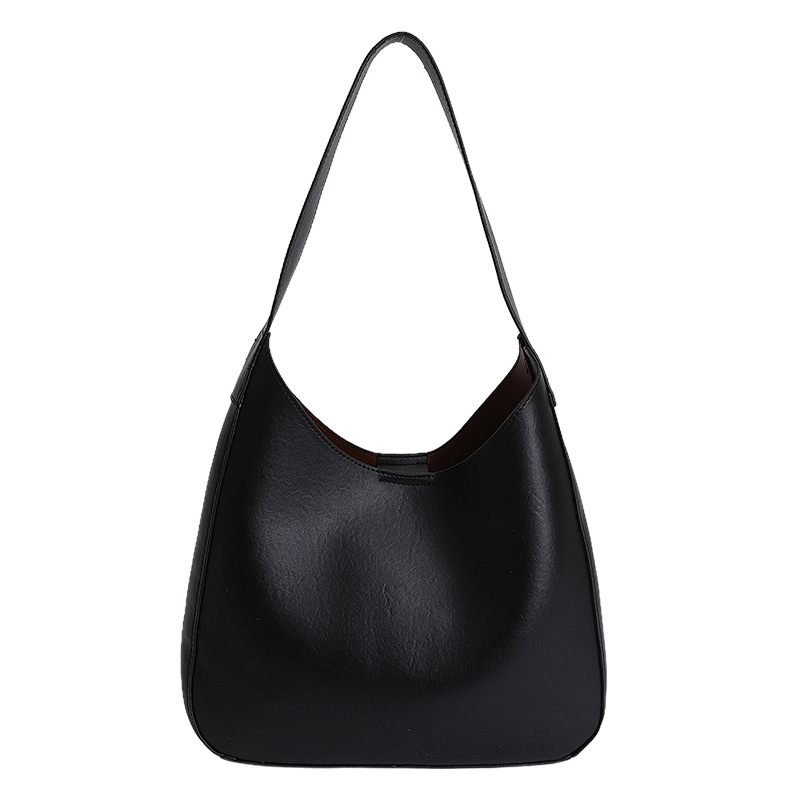Nicho de diseño simple bolso de cubo portátil para mujeres 2026 primavera nueva moda perezosa retro bolso de brazo diario
