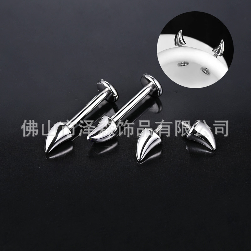 Silver pointed spike labret stud material detail