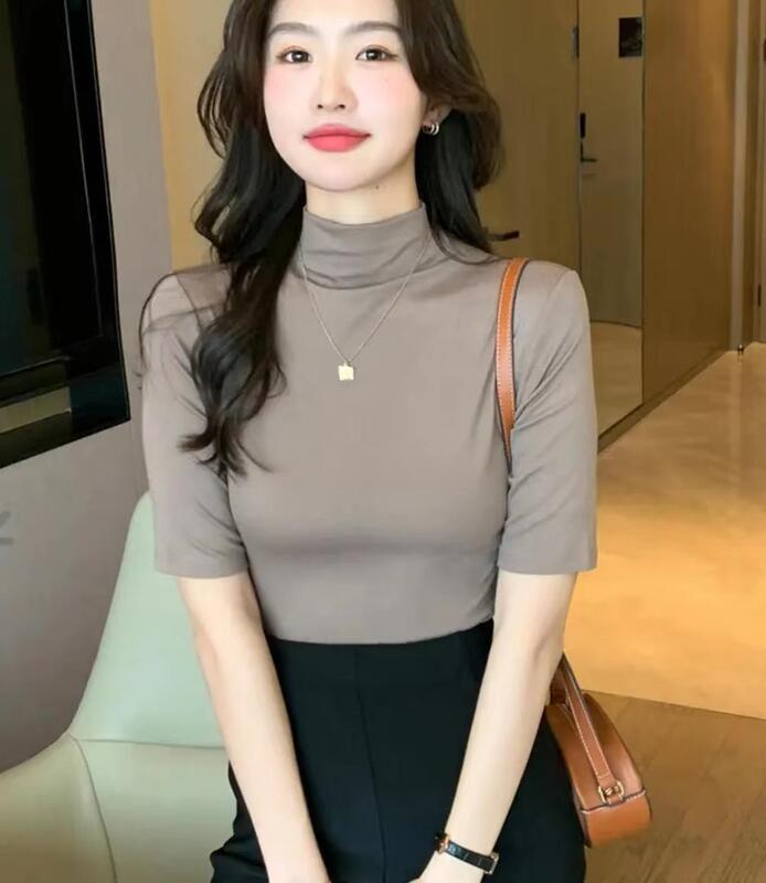 秋冬の小さい立襟の半袖のtシャツの女性の早秋の新型の韓国版は半高襟の5分の袖の純色の上着を身につけます。|undefined