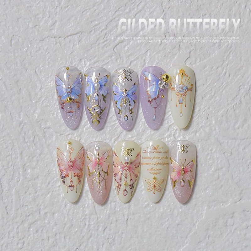 Pegatinas de uñas doradas populares pegatinas de uñas lindas japonesas alivio de fábrica mariposa tridimensional Shell luz Rosa mariposa al por mayor
