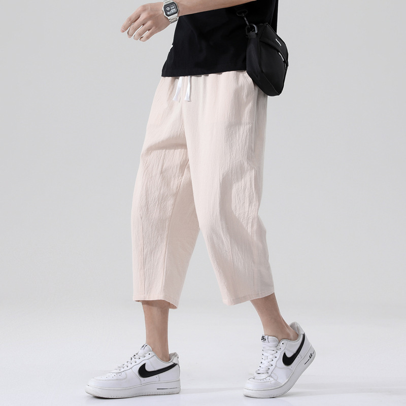 Pantalones recortados pantalones casuales de los hombres de moda verano de los hombres delgados sueltos versión coreana de los hombres de algodón y lino de gran tamaño al por mayor