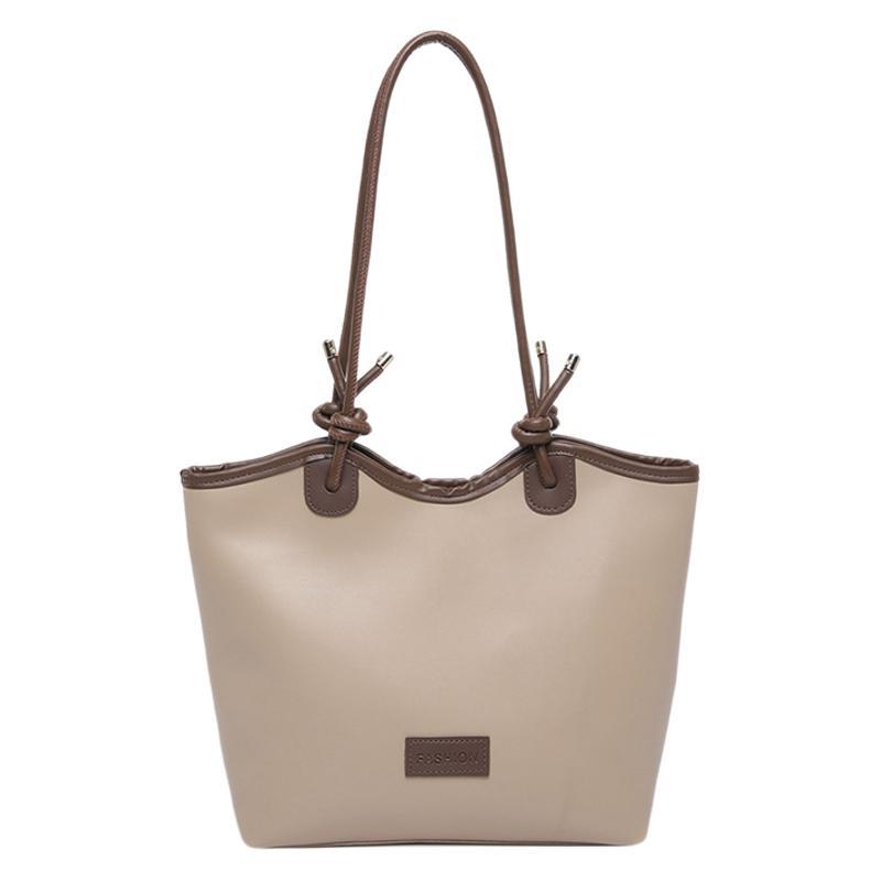 Bagos de mujer de gran capacidad de estilo extranjero simple 2025, nueva moda, bolsas de viaje casuales de hombro, bolsas de hombro debajo de las axilas.