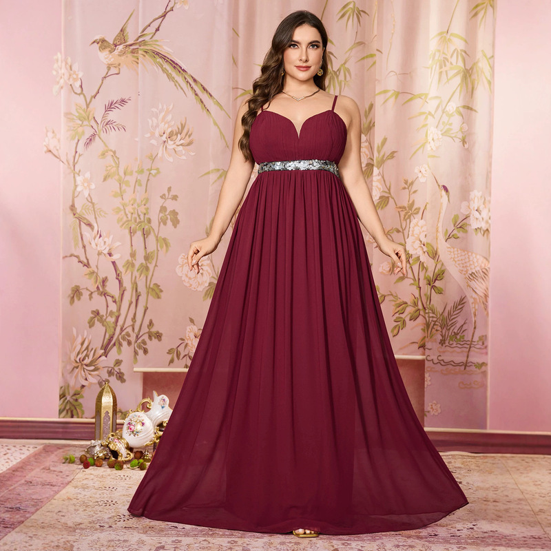 Plus-size evening dress with ruched waist, sequin embellishments, chiffon draping, and elegant full skirt Plus-size evening dress with ruched waist, sequin embellishments, chiffon draping, and elegant full skirt