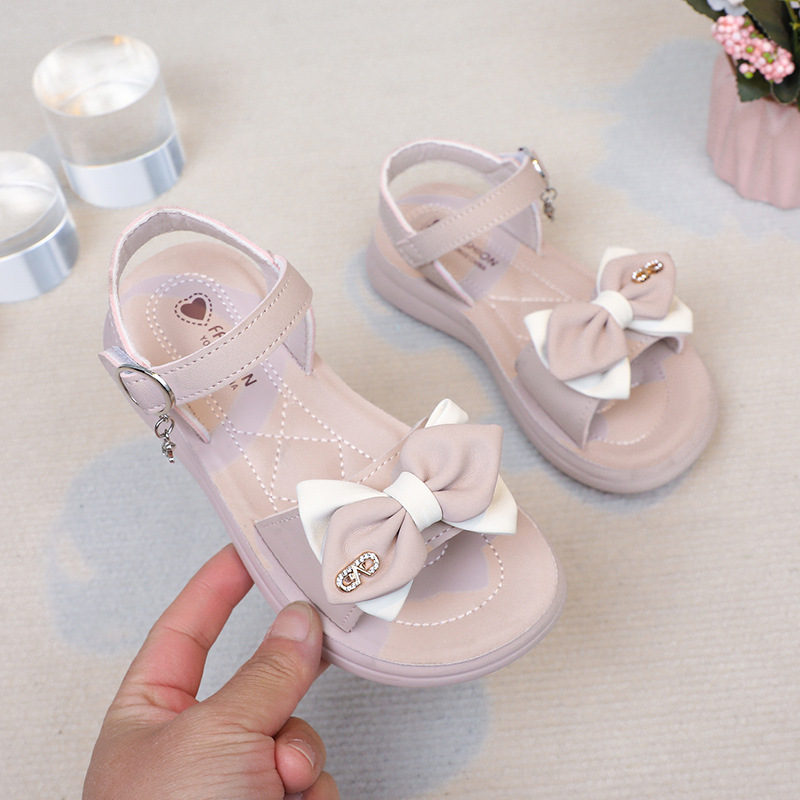 Sandalias para niñas, estilo verano 2026, con lazo y diamantes de imitación, para niñas pequeñas, con suela suave, para la playa