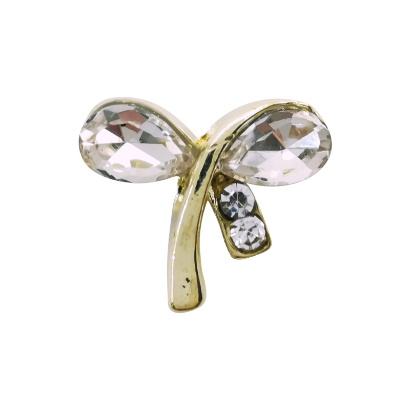 Nuevos accesorios de uñas de aleación especial de comercio electrónico transfronterizo lote mixto sonrisa cara arco uñas pegadas fábrica de diamantes al por mayor