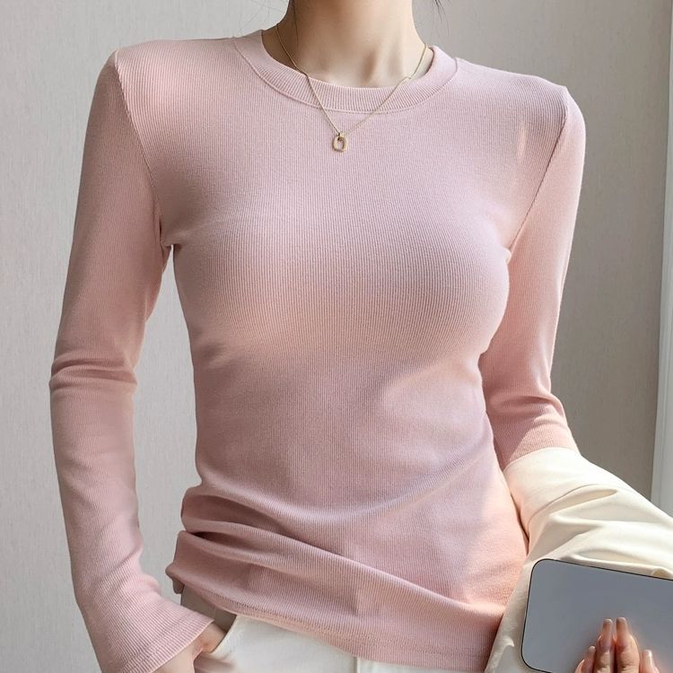 白の底のシャツの女性の2025新型の丸首の綿の長袖のtシャツは身を修める中に上着の春秋の金の洋風を掛けます。