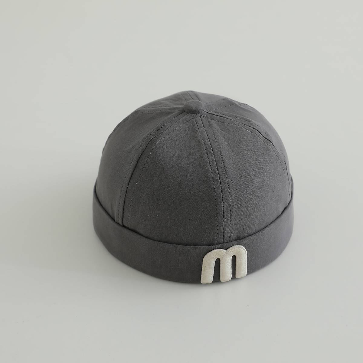 letras coreanas m niños terratenientes sombrero primavera y otoño modelado cóncavo de moda para hombres y mujeres bebés sombrero de tela de color sólido