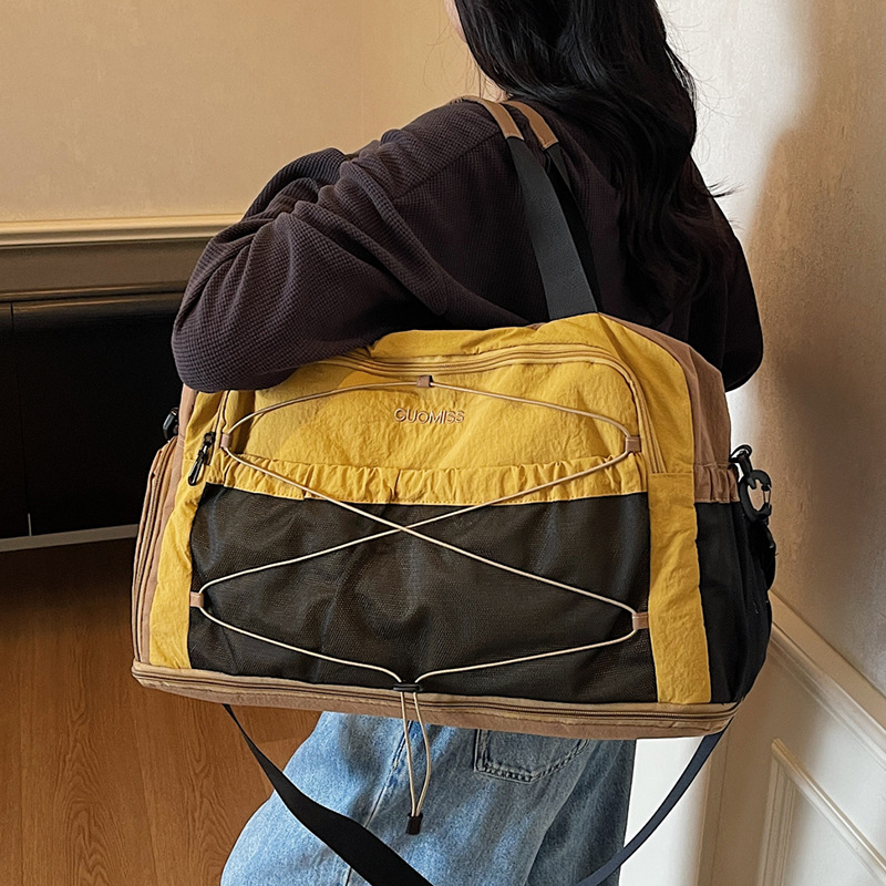 Nicho de diseño de moda moda moda bolsa de mano de mujer gran capacidad bolsa de viaje corto bolsa de almacenamiento bolsa de viaje deportiva al aire libre