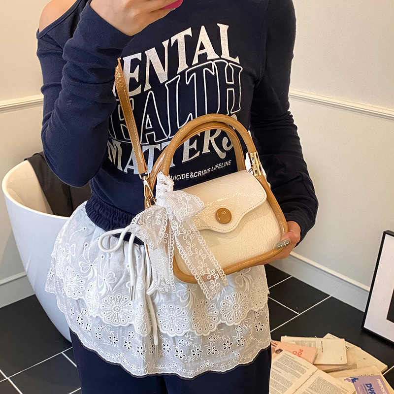 Bolso cuadrado pequeño estilo explosivo único exterior para mujer 2025 nuevo bolso de mensajero simple de color en contraste cuero de cera de aceite bolso de hombro todo fósforo de nicho