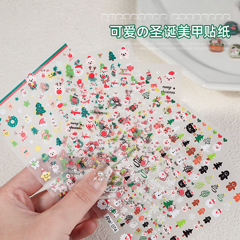 Pegatinas de uñas en relieve Navidad muñeco de nieve copo de nieve Santa Claus 3D tridimensional Internet celebridad pegamento de uñas parche decorativo al por mayor