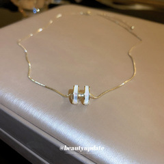 本物の金メッキ貝殻ジルコンのアルファベットのネックレス女性韓国の高級感があります。