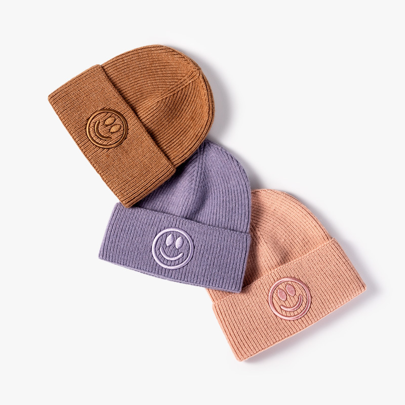 Hombres y mujeres del mismo estilo coreano sombrero de invierno y otoño moda versátil sombrero de punto sonriente sombrero de lana caliente fábrica personalizada