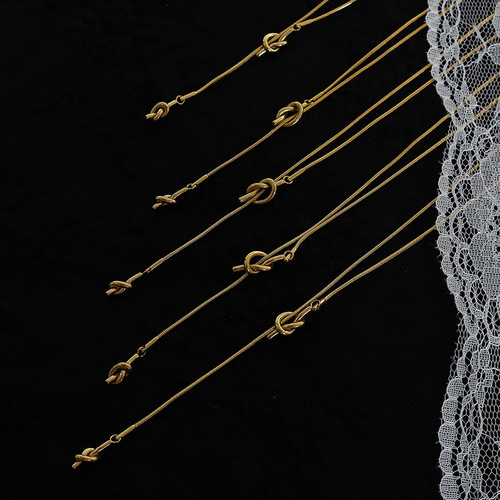 Korean style ins fashion autumn and winter long heart-shaped knotted sweater chain tassel length adjustable titanium steel necklace jewelry