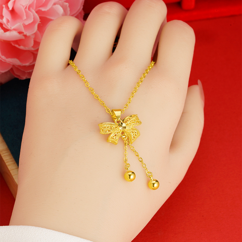 Princesa arco colgante dulce moda todo-fósforo de las mujeres en línea rojo caliente borla DIY arena oro collar Accesorios