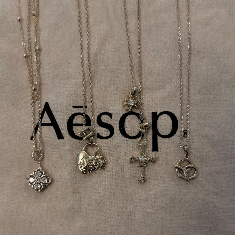 Korean and Japanese Bloggers' Same Style Coffee Gold Korean-Style Niche Design Necklace, Four-Leaf Clover, Heart, Cross, Various Locks Korean and Japanese Bloggers' Same Style Coffee Gold Korean-Style Niche Design Necklace, Four-Leaf Clover, Heart, Cross, Various Locks