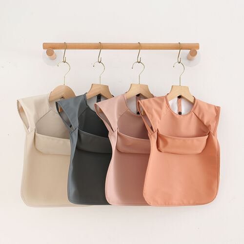 Danish children's sleeveless pu reverse-dressing baby eating clothes bib super soft waterproof solid color rice pocket anti-dirty feeding clothes