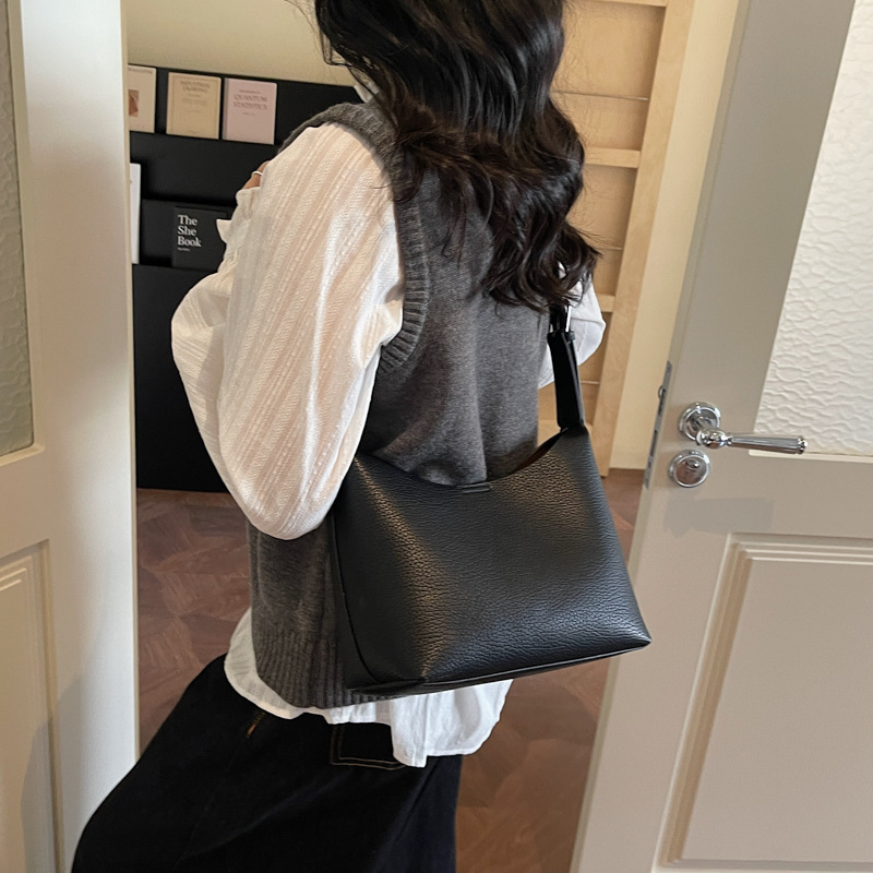 Bolsos de cubo retro de alta calidad para mujeres otoño / invierno 2025 nuevo nicho Zhong commuting mochila de hombro bolso de trabajo diario