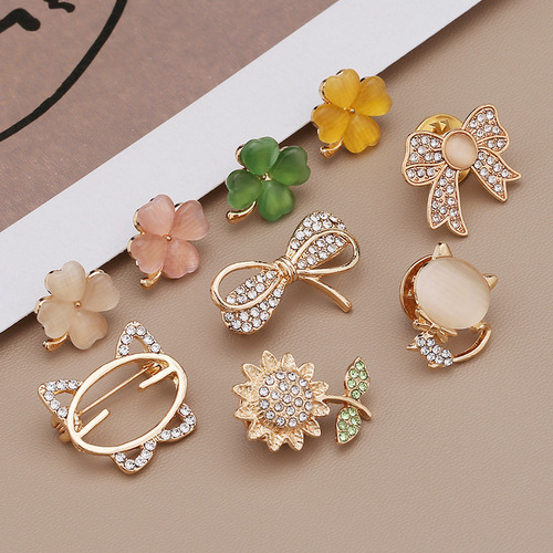 Wholesale anti-exposure buckle brooch, high-end bow, snowflake pin, small fragrance style decorative metal jewelry for clothing neckline