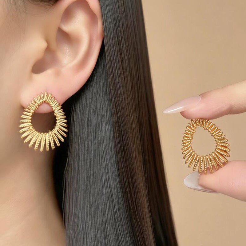 golden fashionable copper earrings drop-shaped