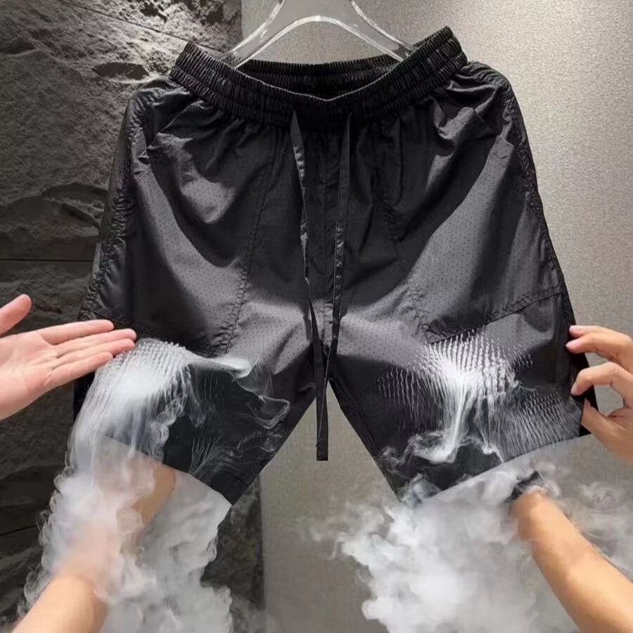 Pantalones cortos de malla transfronterizos estadounidenses de estilo de moda masculino delgados de diseño de nicho sueltos grandes pantalones deportivos casuales de cinco puntos