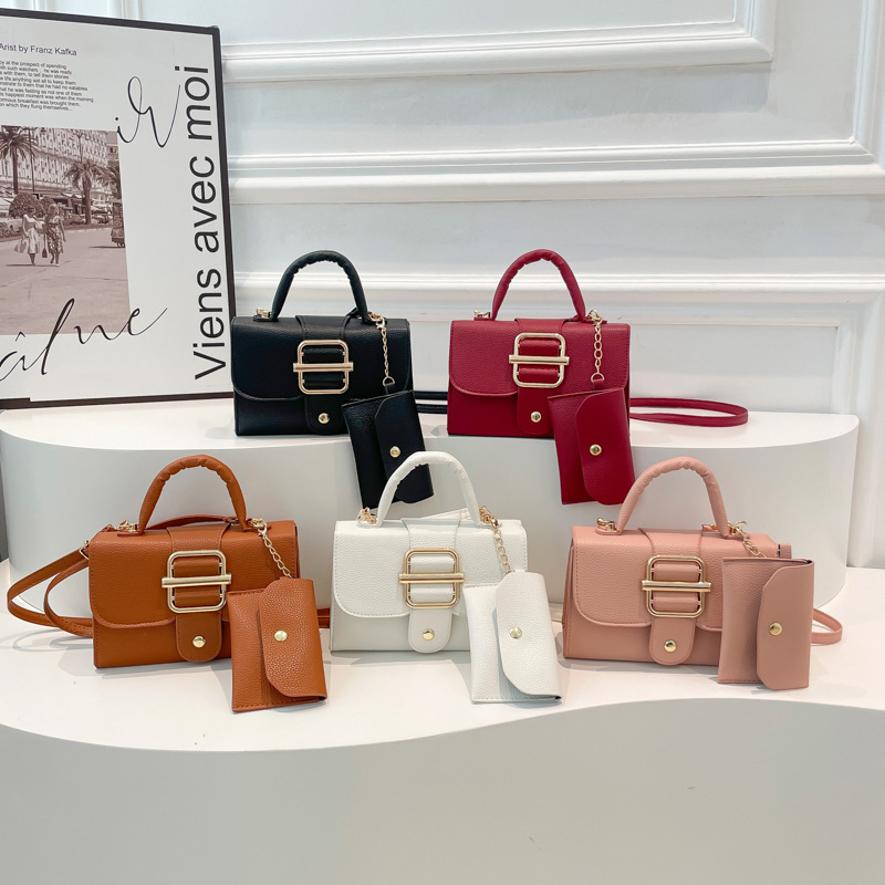 Texturas de moda extranjera bolso de mano 2025 primavera nuevo lichi patrón bolso de hombro cinturón hebilla bolso de mujer