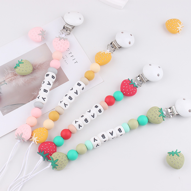 Nuevos productos para bebés Clip de chupete redondo de madera para calmar la cadena de chupete de silicona de fresa de dibujos animados para bebés